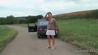 Young And Attractive Girl Entices Grandpa Outdoors